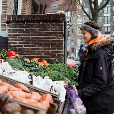Woman shopping at a fresh farm stand